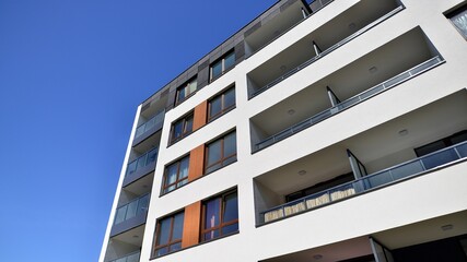 Apartment residential house and home facade architecture and outdoor facilities. Blue sky on the background. Sunlight in sunrise.