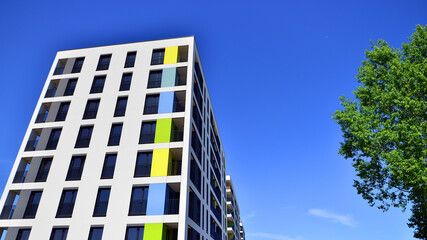 Apartment residential house and home facade architecture and outdoor facilities. Blue sky on the background. Sunlight in sunrise.
