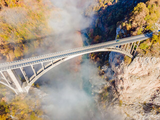 Montenegro. Dzhurdzhevich Bridge Over The River Tara foggy morning