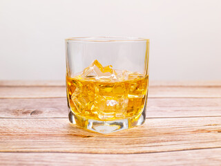 glass for liquor Translucent elements made of glass are placed on a wooden table. empty objects isolated on white background