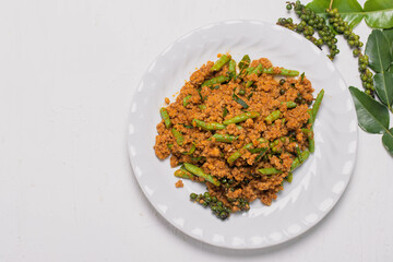 Stir fried chilli paste with ground pork in a white plate Thai southern style spicy stir fried Thai food