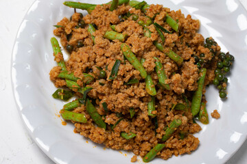 Stir fried chilli paste with ground pork in a white plate Thai southern style spicy stir fried Thai food