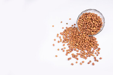 chickpeas (Bengal Gram) in glass bowl on white background. Close up of Organic chana or chickpea (Cicer arietinum). for design and banner. top view chickpeas.