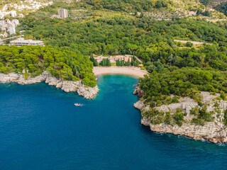 Obraz premium Queen's Beach in Milocer, Montenegro. Aerial view of sea waves and fantastic Rocky coast, Montenegro