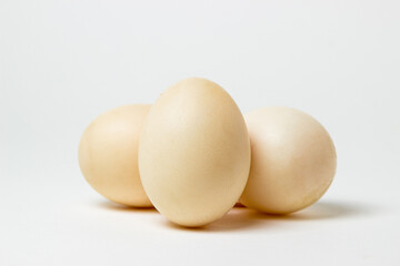 White duck eggs on a white background. Useful and delicious food.