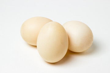 White duck eggs on a white background. Useful and delicious food.