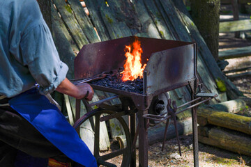 blacksmith on fire at work