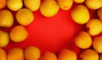 top view apricots on red background
