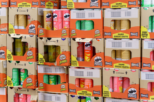 Tyumen, Russia-May 08, 2022: Pringles crisp snacks, variety of flavors on shelf of hypermarket. Pringles brand owned by Kellogg Company. Selective focus