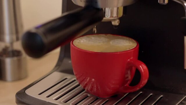 Cup of coffee filled full, making long espresso with machine at home, static