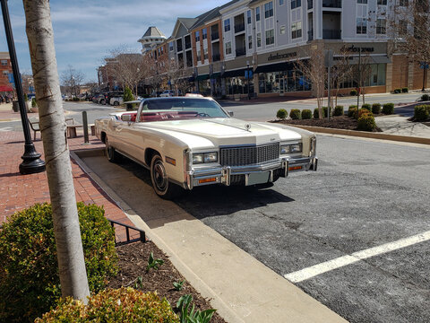 Vintage 1970s Cadillac Is Parked Outside The Restaurant.