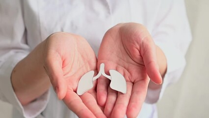 World no tobacco day, lung cancer, Pulmonary hypertension. World Pneumonia Day or world tuberculosis day, copd. Young female doctor holds lung.