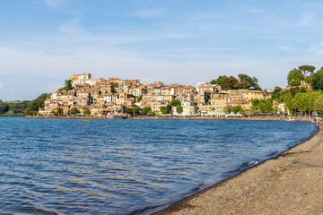 Fototapeta na wymiar Picturesque view of Lake Bracciano and Anguillara Sabazia village in the province of Rome, Italy.