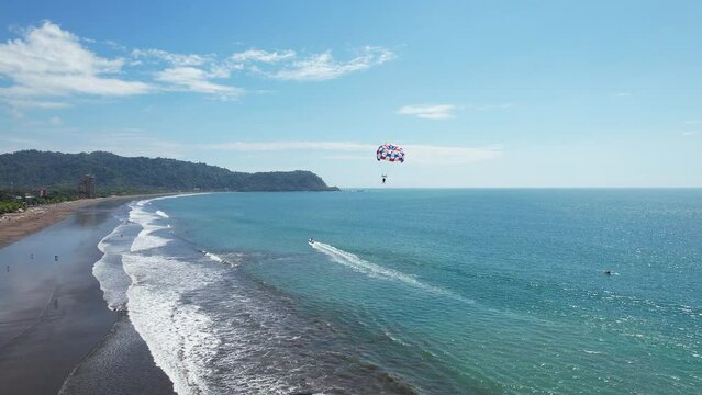 Aerial images of the beach on a sunny day, following water parachute, Aerial drone images, Beach Jaco, Puntarenas, Costa Rica, Dolly Inn, Tracing.