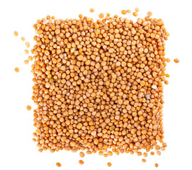 Mustard seeds isolated on white background. Pile of dry mustard grains. Top view.