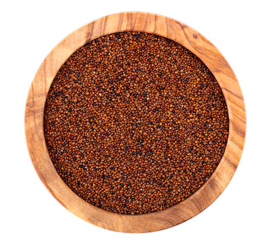 Canihua grains isolated on white background. Pile of qaniwa in olive bowl. Dry grains of chenopodium pallidicaule. Top view.