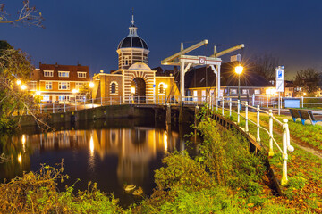 Night city gate Morspoort and Morspoort Bridge in Leiden, South Holland, Netherlands