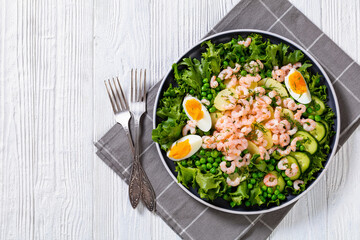 pink cocktail shrimps salad with veggies and eggs