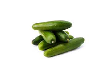 Stack tasty mini green cucumbers on a white background