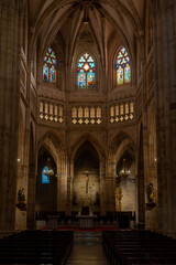 Fototapeta na wymiar interior view of the cathedral of Bilbao in Spain, with its stained glass windows, altar and pews.