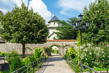 Fototapeta na wymiar Monastery wall of Moraca monastery. Serbian Orthodox monastery located in valley of Moraca River in Kolasin, central Montenegro. Medieval monuments of Montenegro