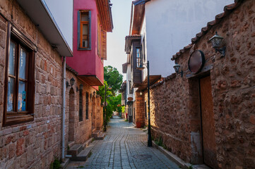 Title	
View of street in Kaleici historical district of Antalya in Turkey. Old town is popular destination among tourists in Antalya.	