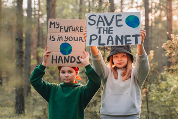 teenagers looking to camera with My Future in Your Hands poster support save planet  movement....