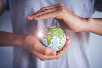 Woman holding earth in hands, Energy saving concept.