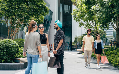 Two Small Group Of Five People Enjoying Shopping In The City