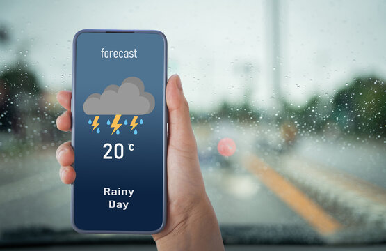 woman with smart phone using weather forecast app.