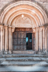 Fototapeta na wymiar Santa Maria, Siurana church - front door. Tarragona, Spain
