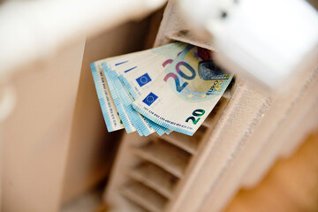 Heating thermostat with money. Expensive heating costs concept. Payment for warm house in winter....