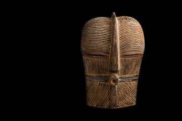 African mask on a black background