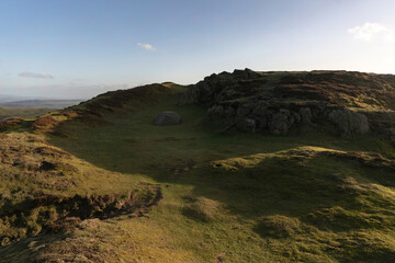 A wild camping tent on a green British mountain in the Shropshire Hills