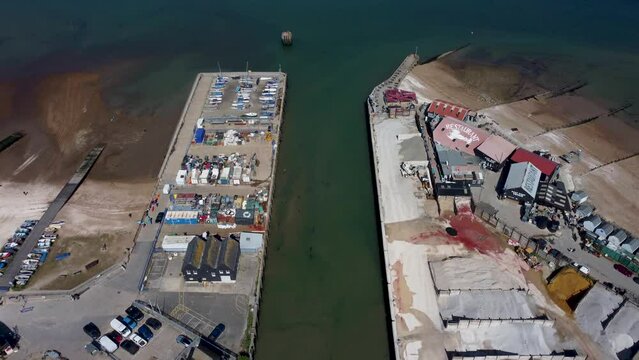 An aerial dolly forward over the Whitstable Harbour.