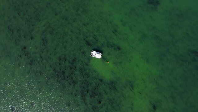 A fast aerial spinning shot of the sea, off the coast of Whitstable.