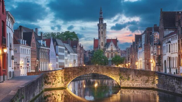 Bruges, Belgium. View of  Spiegelrei canal at dusk (static image with animated sky and water)
