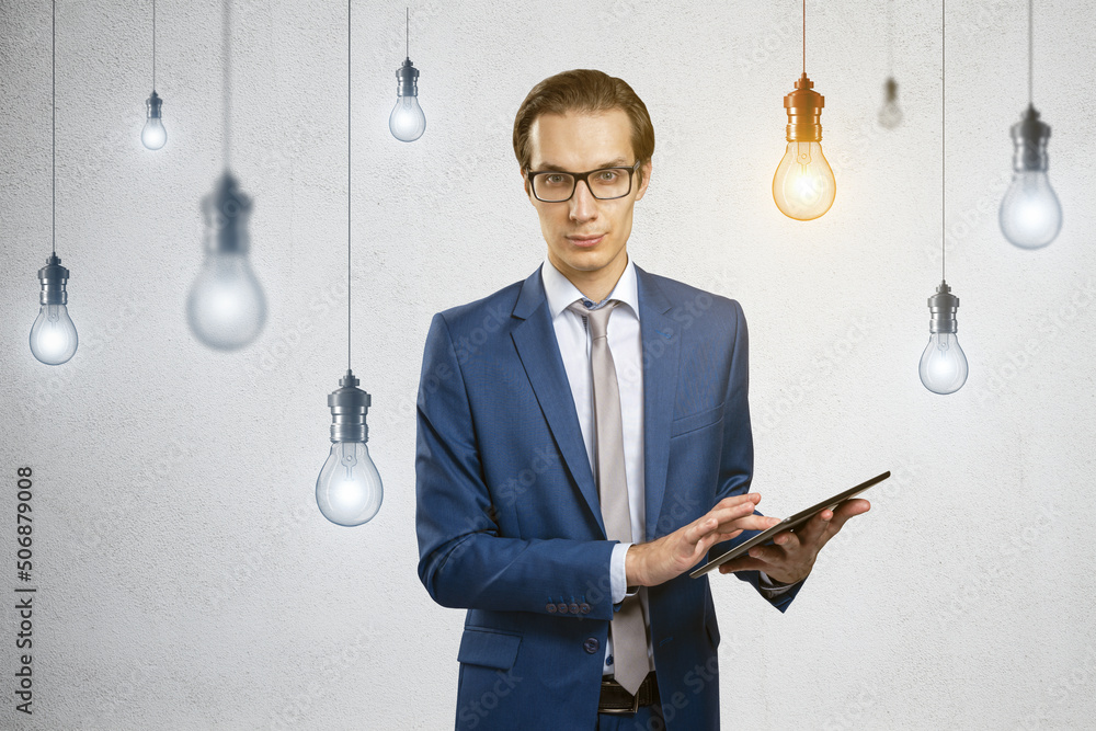 Aufkleber idea and technological startup concept with young businessman in suit and glasses using digital tabl