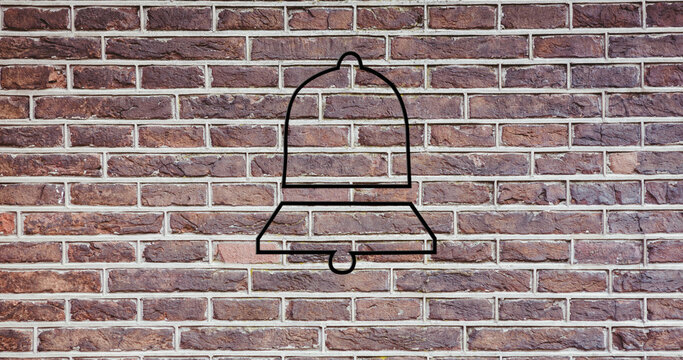 Image of glowing neon bell icon on brick wall