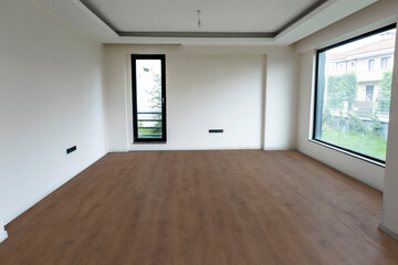 Empty interior background, room with white walls, big and small window floors tiled parquet.