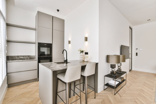 Kitchen zone with counter in modern studio apartment