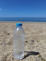water bottle by the sea in summer holidays