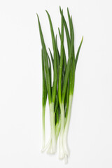 green chives onion against white background 