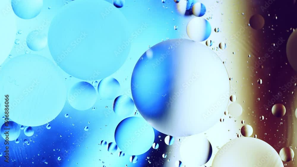 Poster real close up oil bubbles in water rotation with color gradient abstract mixing background.