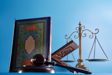 sharia law concept , gavel hammer libra scale and holly koran