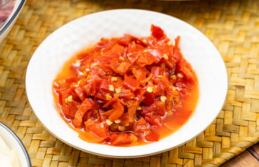 Fresh chopped peppers in a small white china plate