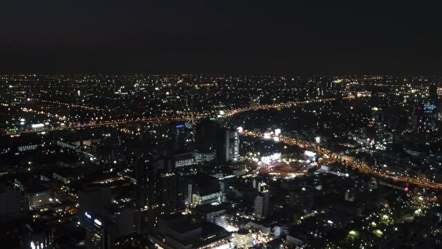 Bangkok, Thailand, Timelapse - Pan motion view of Bangkok at night as seen from the Baiyoke Tower