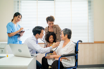 Young doctor use stethoscope analysis the disease of senior woman and her relate stay beside with grandchild and daughter in consulting room of hospital.