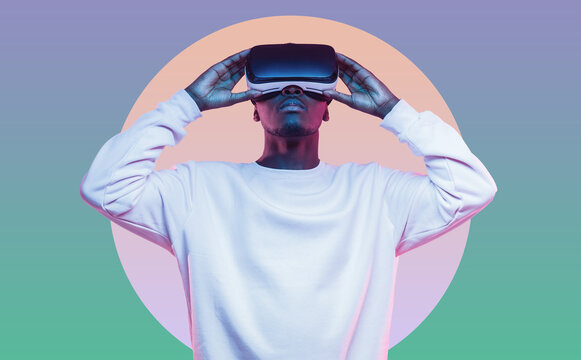 Young african man wearing virtual reality headset