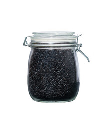 Heap of uncooked wild black rice grains in glass storage jar isolated on white background.